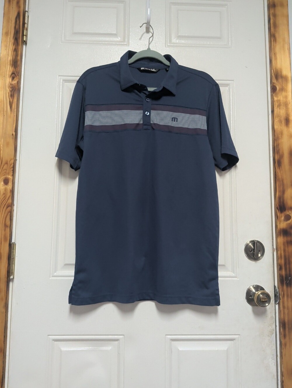 Travis Mathew Navy Polo with Contrast Chest Stripes